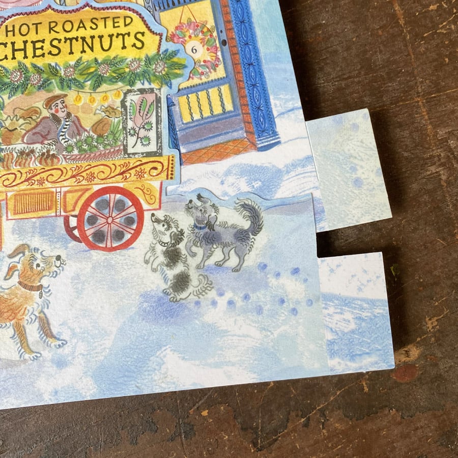 Emily Sutton's illustrated High Street advent calendar, upright against a wooden backdrop