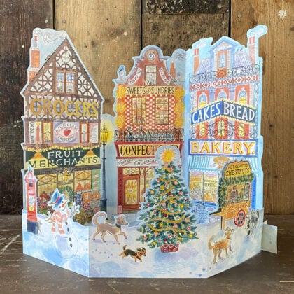 Emily Sutton's illustrated High Street advent calendar, upright against a wooden backdrop