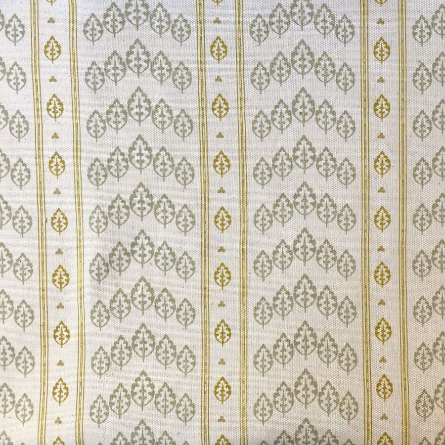 Striped pattern fabric on a slant with a repeated tree design in flax and yellow