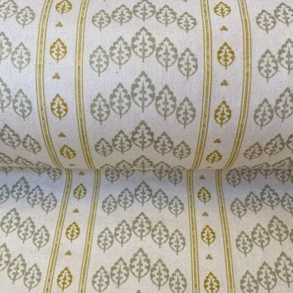 Striped pattern fabric on a slant with a repeated tree design in flax and yellow