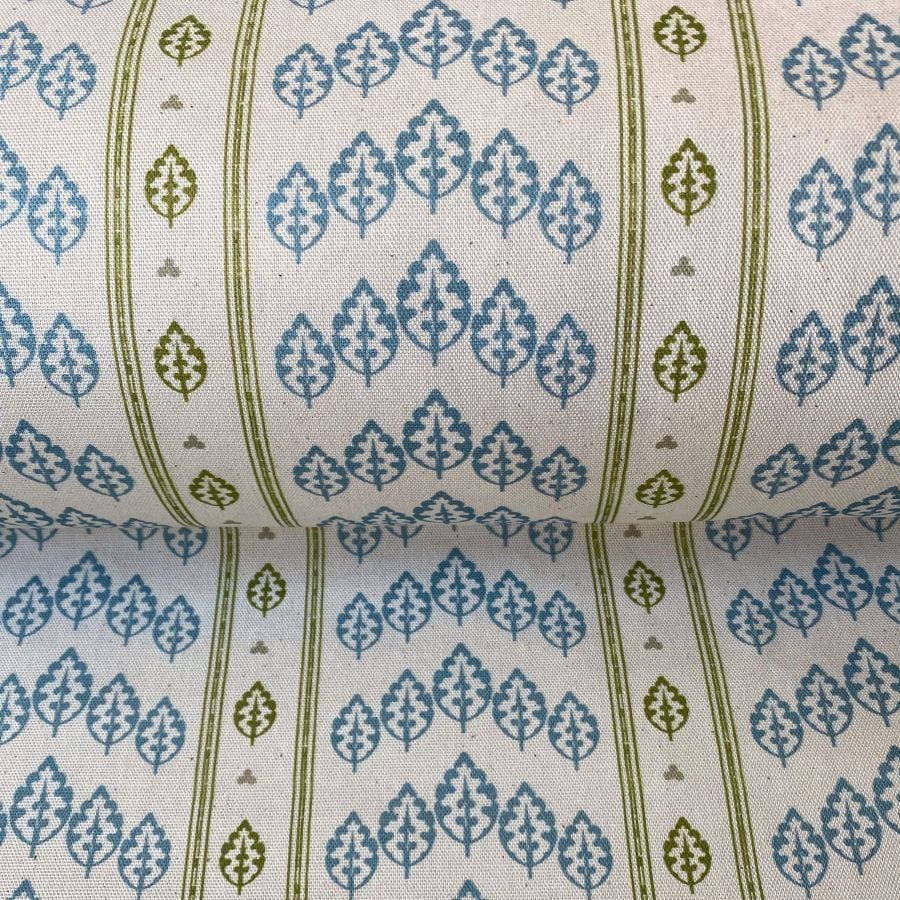 Striped pattern fabric with a repeated tree design in blue and olive green