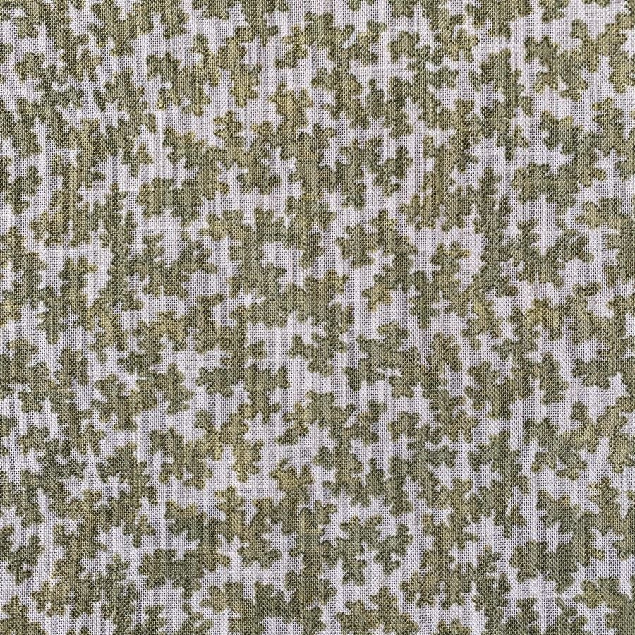 Fabric featuring a small scale coral design in olive green
