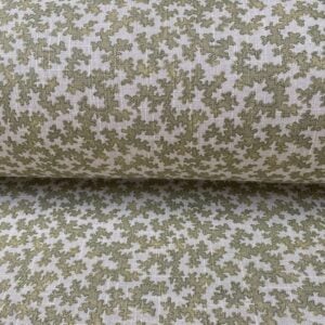 Slanted roll of fabric featuring a small scale coral design in olive green