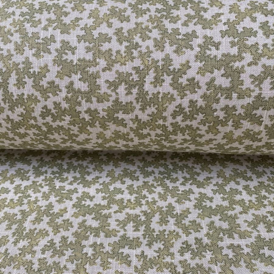 Slanted roll of fabric featuring a small scale coral design in olive green