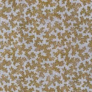 Fabric featuring a small scale coral design in mustard yellow