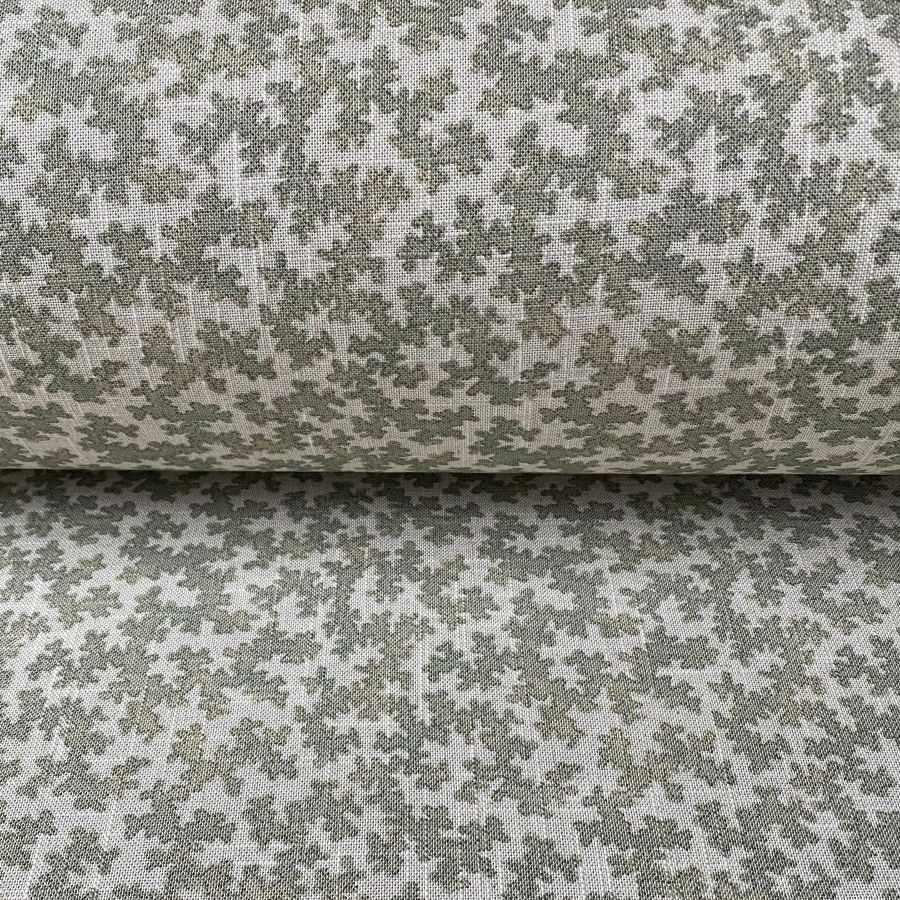 Detail of a small scale fabric design on a roll