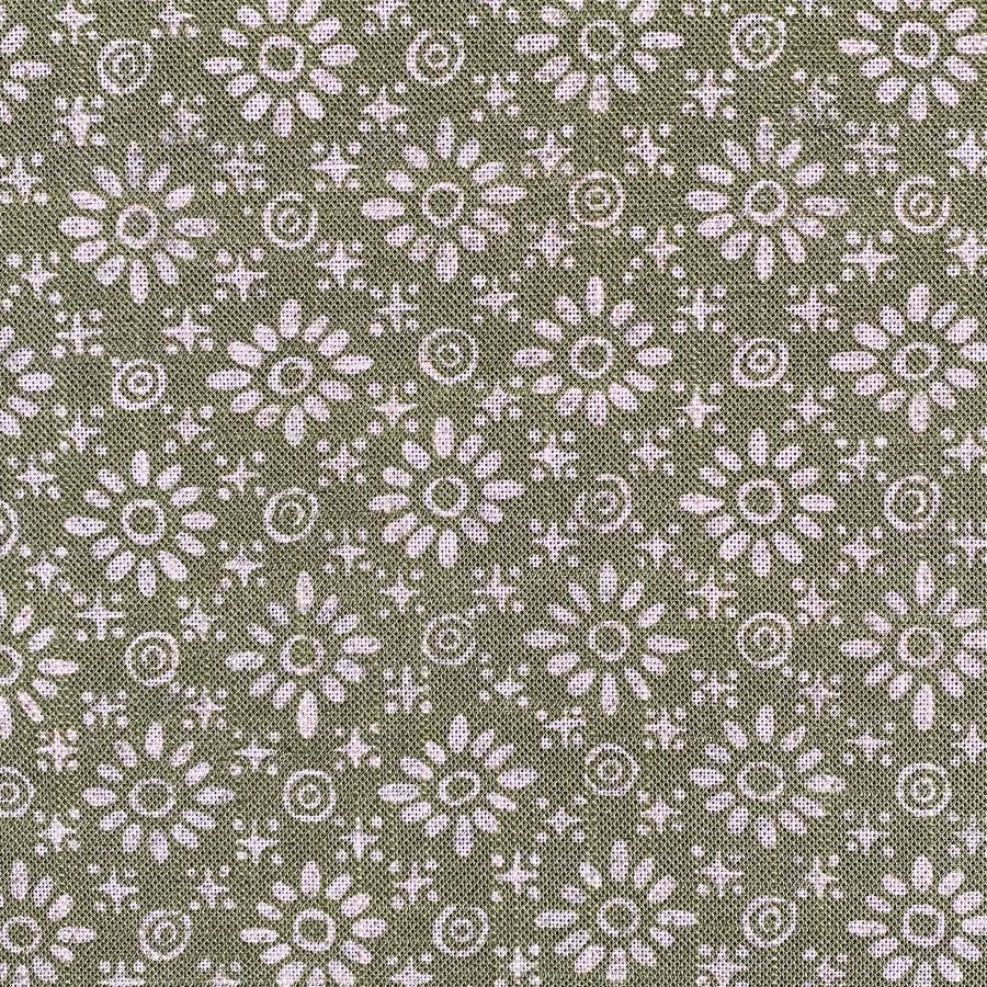 Fabric roll with green, small scale daisy pattern
