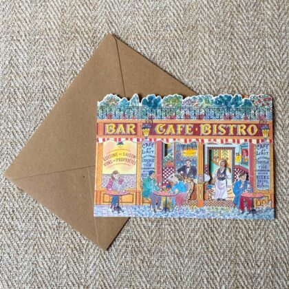 3d stand up card of a cafe bistro shop against a pale fabric background