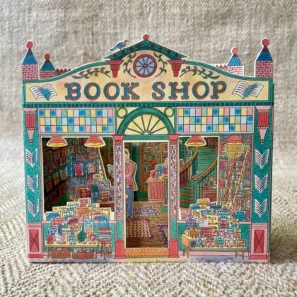 3D upright card of a book shop illustrated by Emily Sutton against a pale fabric background