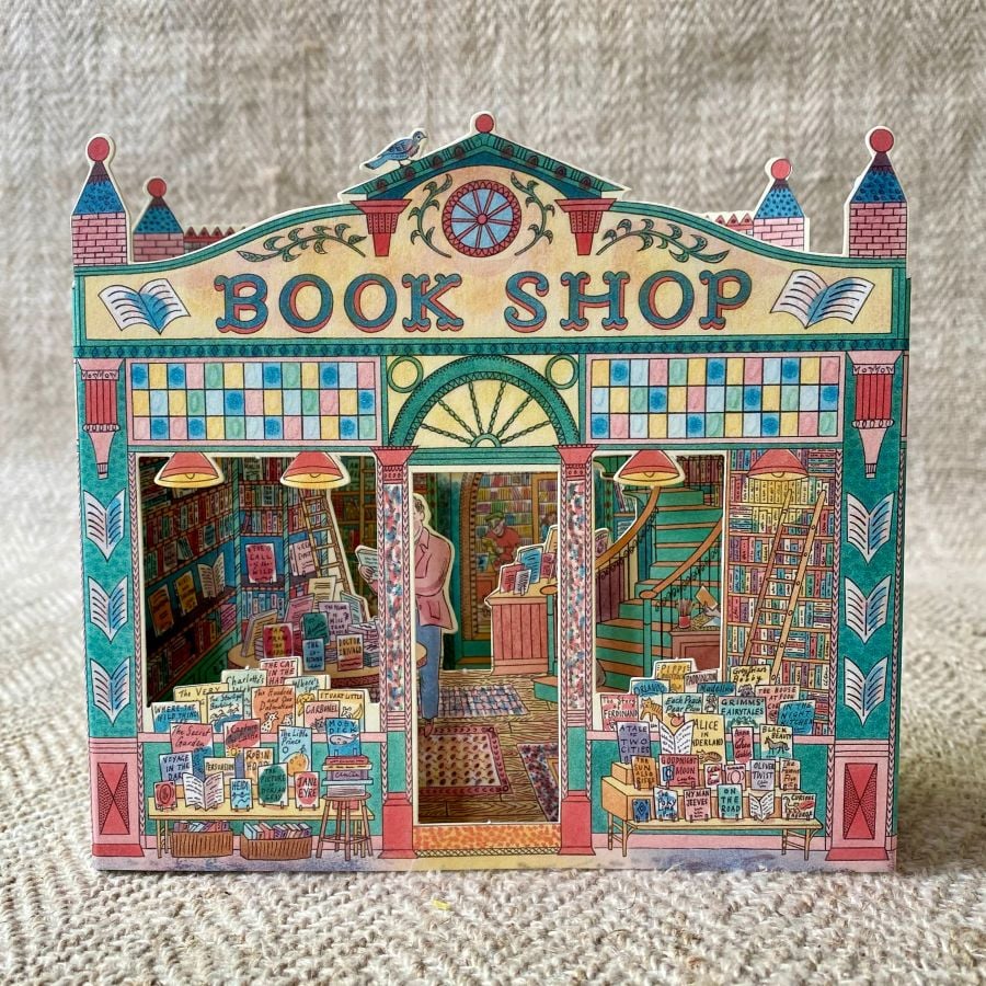 3D upright card of a book shop illustrated by Emily Sutton against a pale fabric background