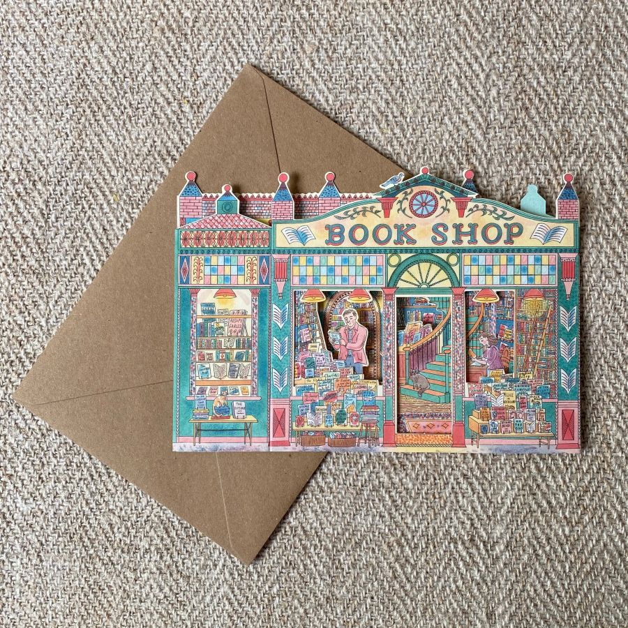 3D upright card of a book shop illustrated by Emily Sutton against a pale fabric background