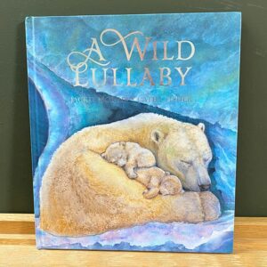 Front cover of a book called The Wild Lullaby with a watercolour image of a mother & cub polarbear asleep